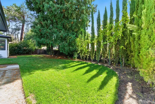 a view of a backyard with a garden