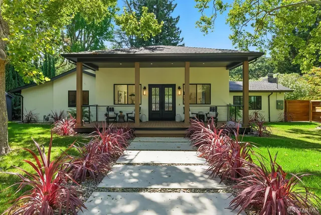 a front view of a house with garden