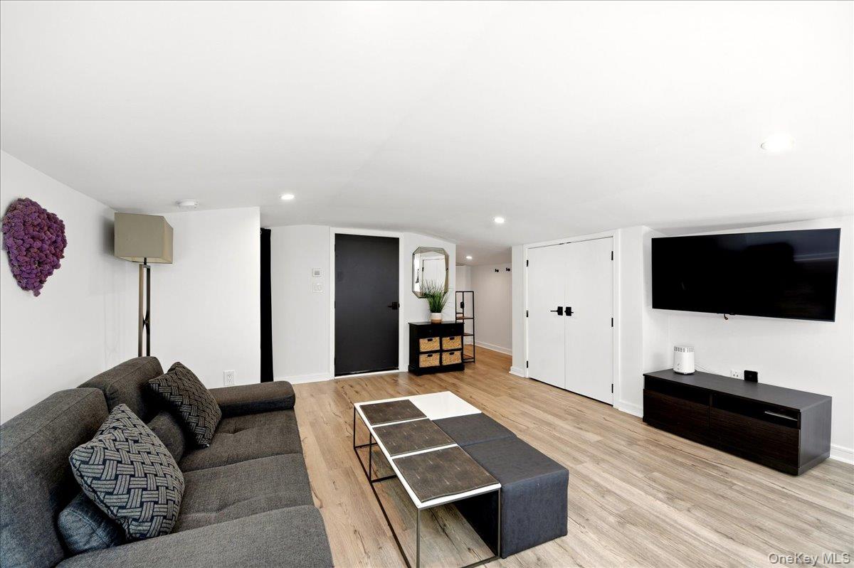93 Fordham Street Bronx, NY 10464 - Photo 10 of 41 a living room with furniture and a flat screen tv