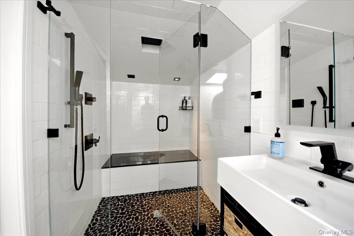 93 Fordham Street Bronx, NY 10464 - Photo 11 of 41 a bathroom with a sink a toilet and shower