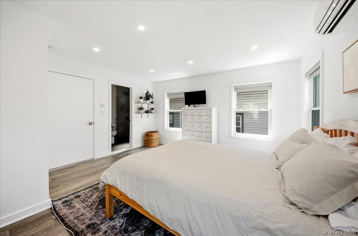93 Fordham Street Bronx, NY 10464 - Photo 18 of 41 a bedroom with a large bed and a large window