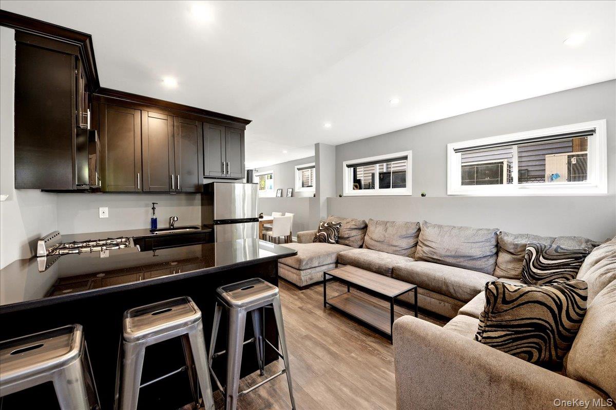93 Fordham Street Bronx, NY 10464 - Photo 29 of 41 a living room with furniture and kitchen view