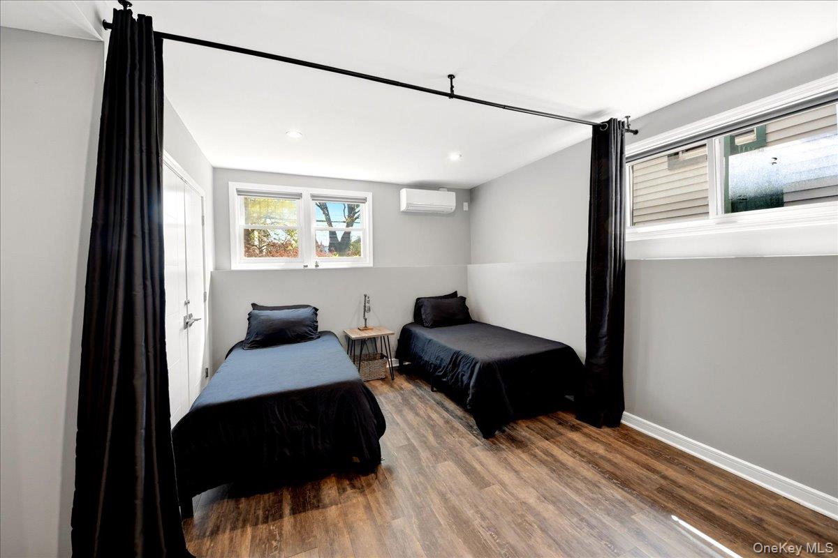 93 Fordham Street Bronx, NY 10464 - Photo 32 of 41 a bedroom with a bed window and walk in closet