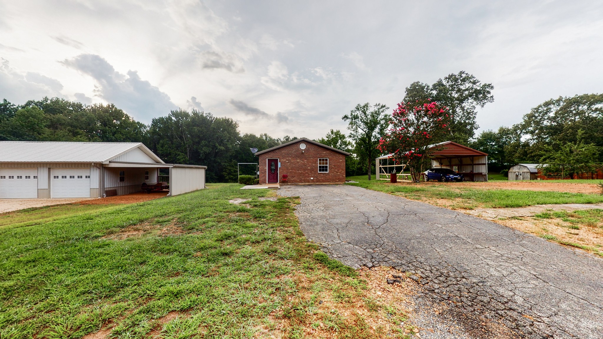 1425 India Road Paris, TN 38242 - Photo 1 of 18 a view of a house with a yard and sitting area