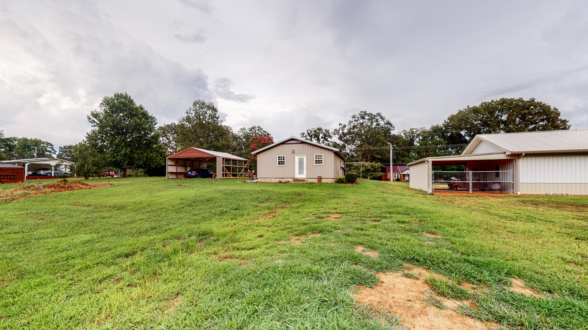 1425 India Road Paris, TN 38242 - Photo 2 of 18 a front view of a house with garden