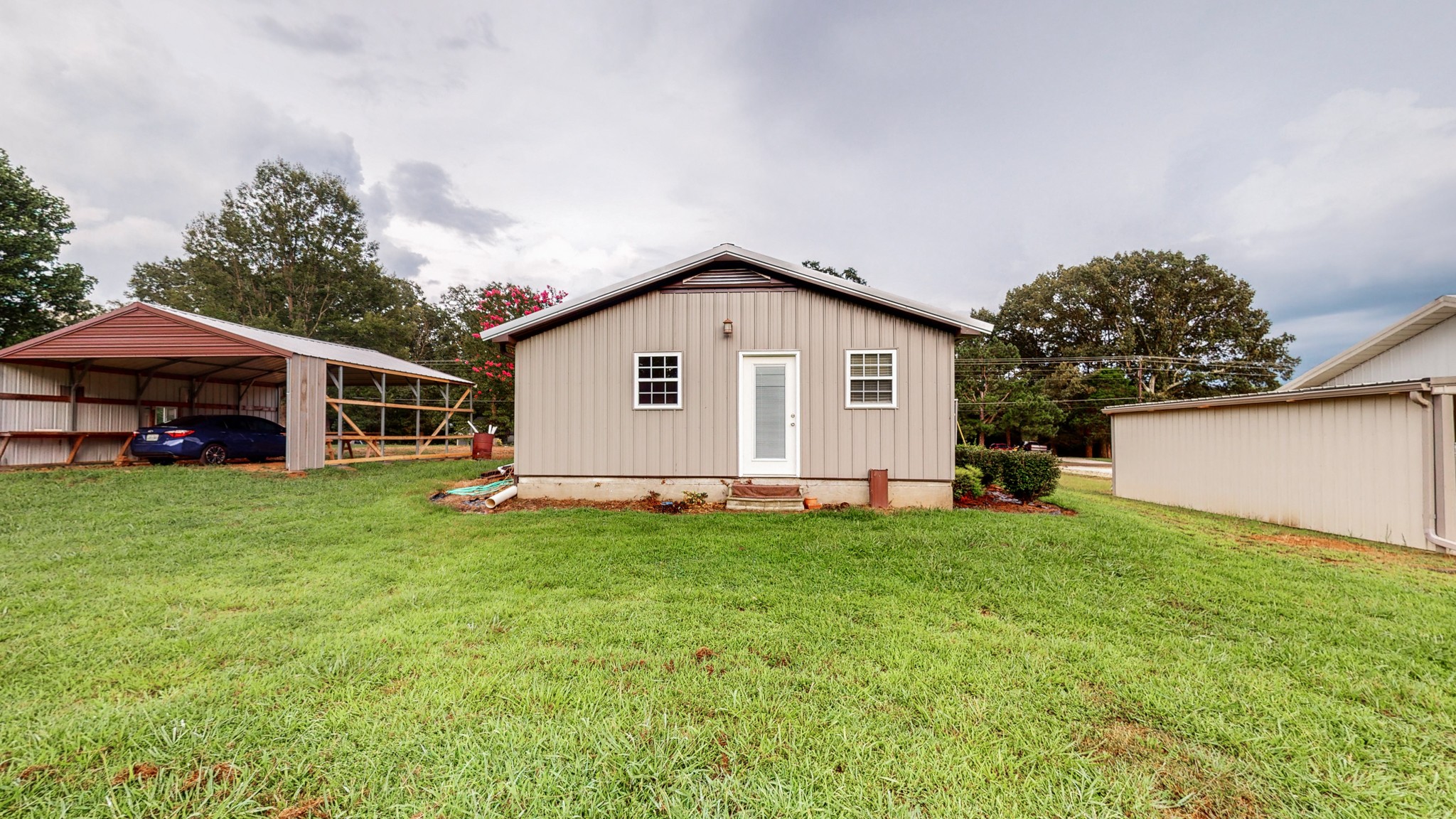 1425 India Road Paris, TN 38242 - Photo 4 of 18 a view of a house with a yard and sitting area