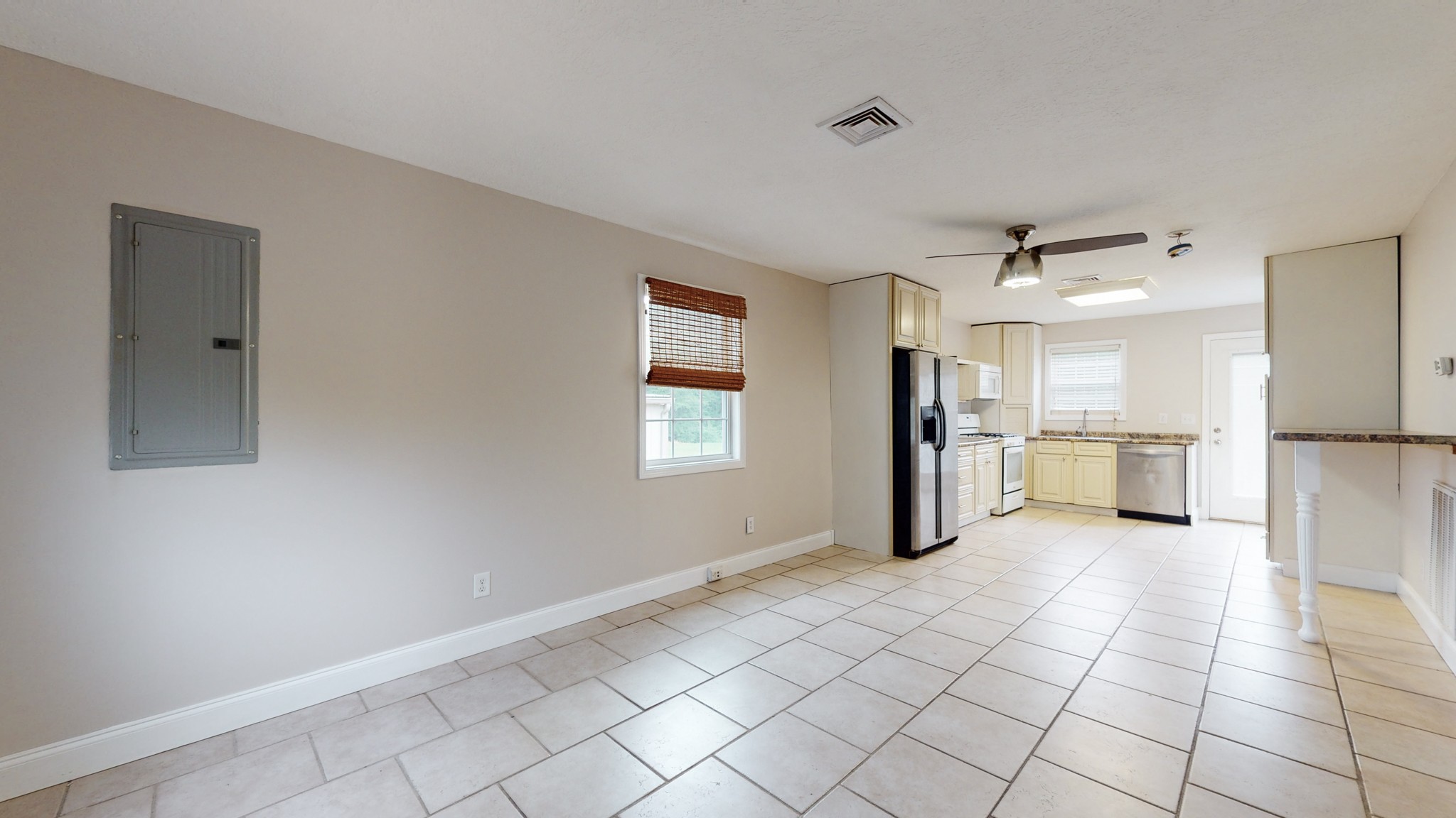 1425 India Road Paris, TN 38242 - Photo 9 of 18 a view of a kitchen with a sink and dishwasher refrigerator freezer