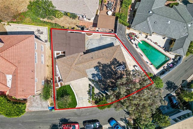 an aerial view of house with yard