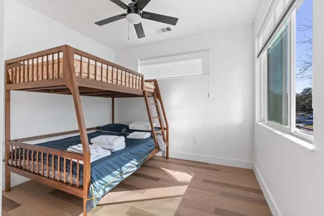 a bathroom with a sink vanity and mirror