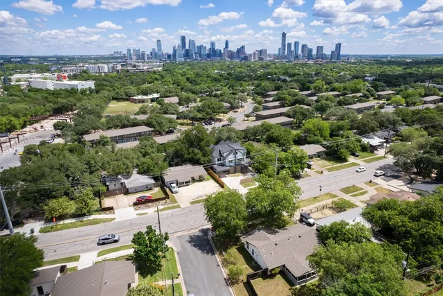 an aerial view of a city with lots of residential buildings