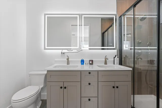 a bathroom with a shower and a toilet