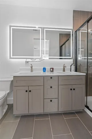 a view of a yard with wooden fence and a large tree