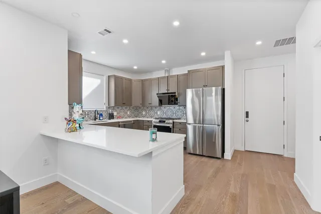 a kitchen with a table and chairs in it