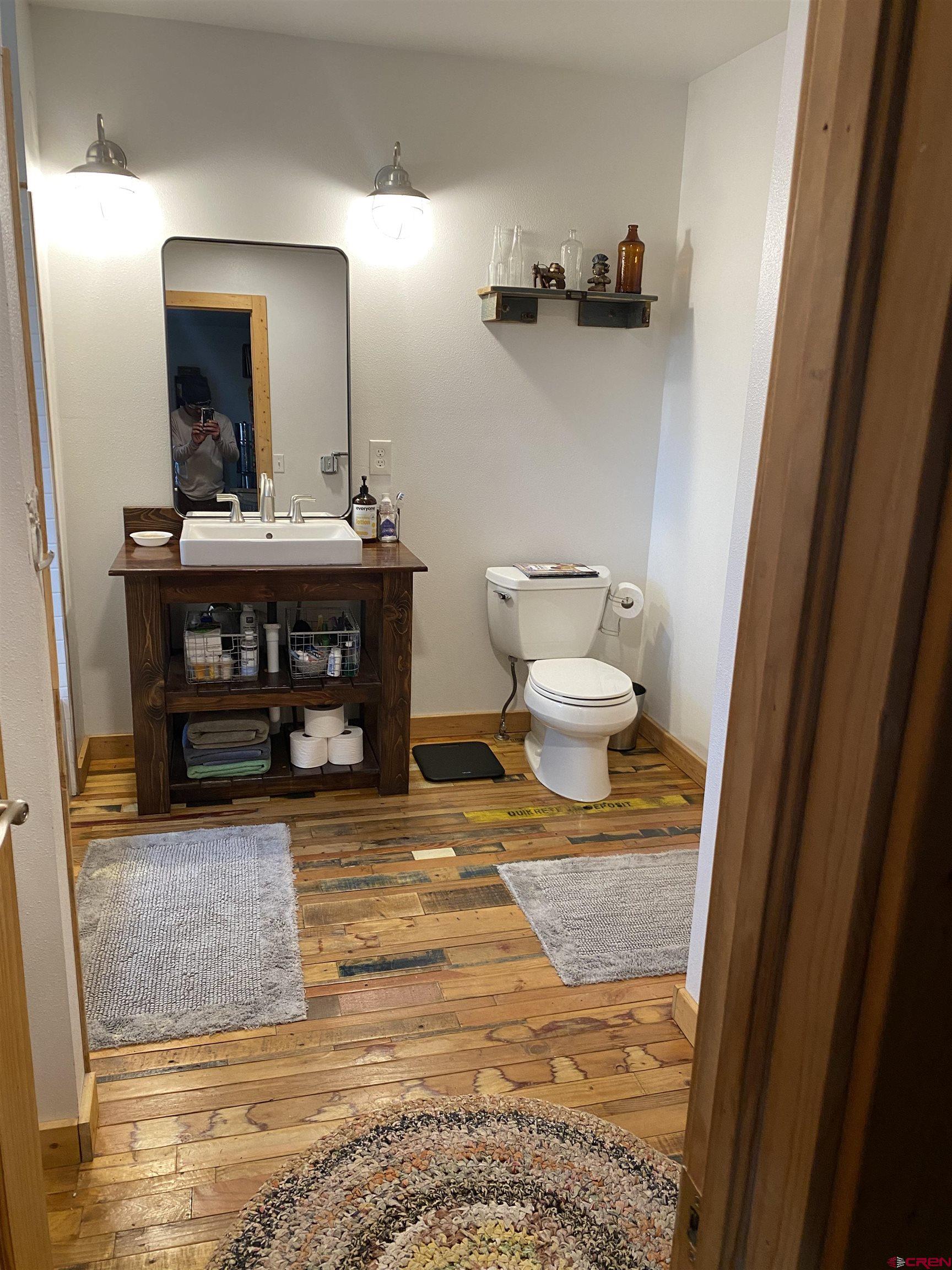 593 Crest Drive Cimarron, CO 81220 - Photo 15 of 30 a bathroom with a sink and a mirror