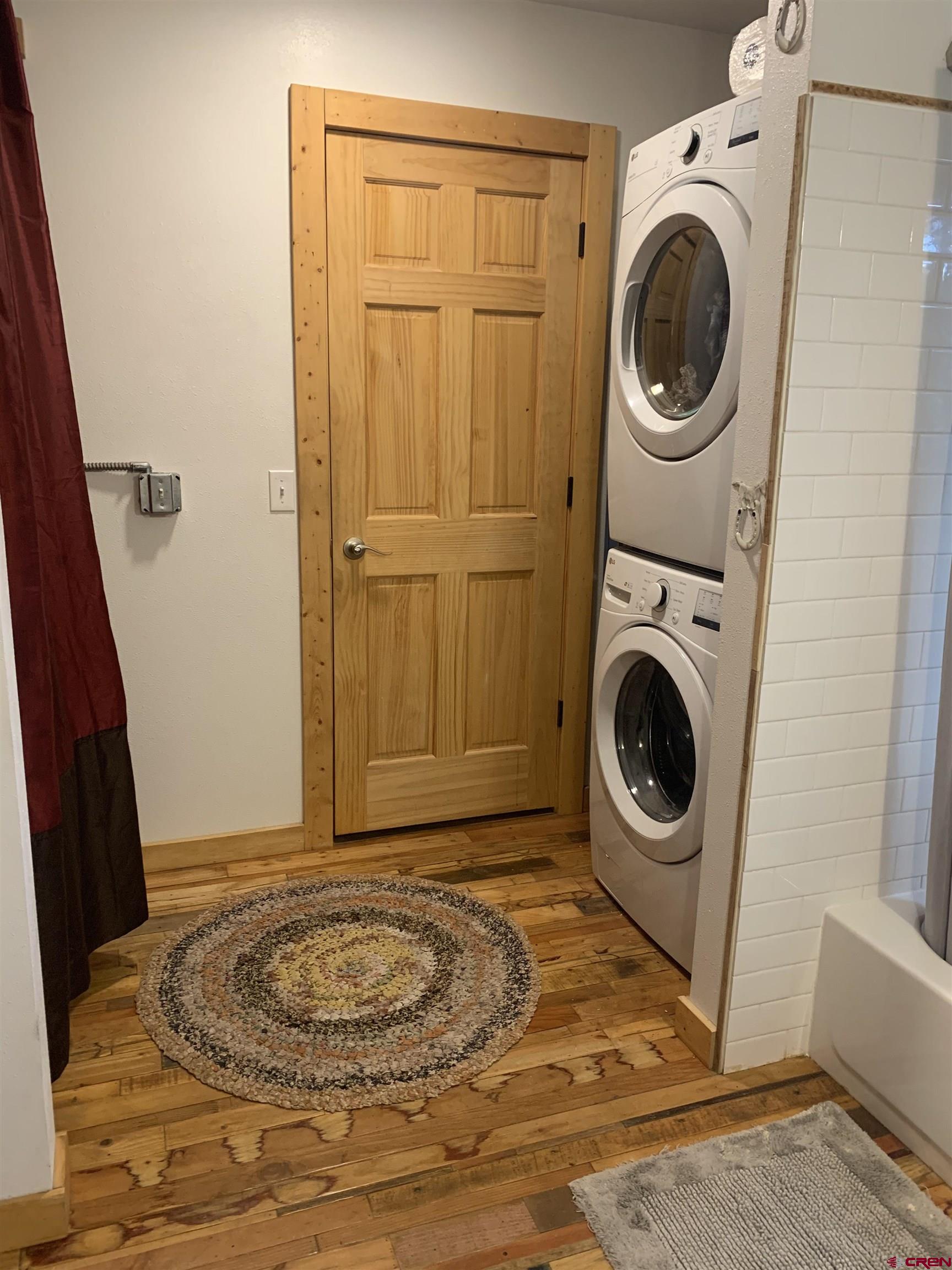 593 Crest Drive Cimarron, CO 81220 - Photo 17 of 30 a view of a bedroom with washer and dryer