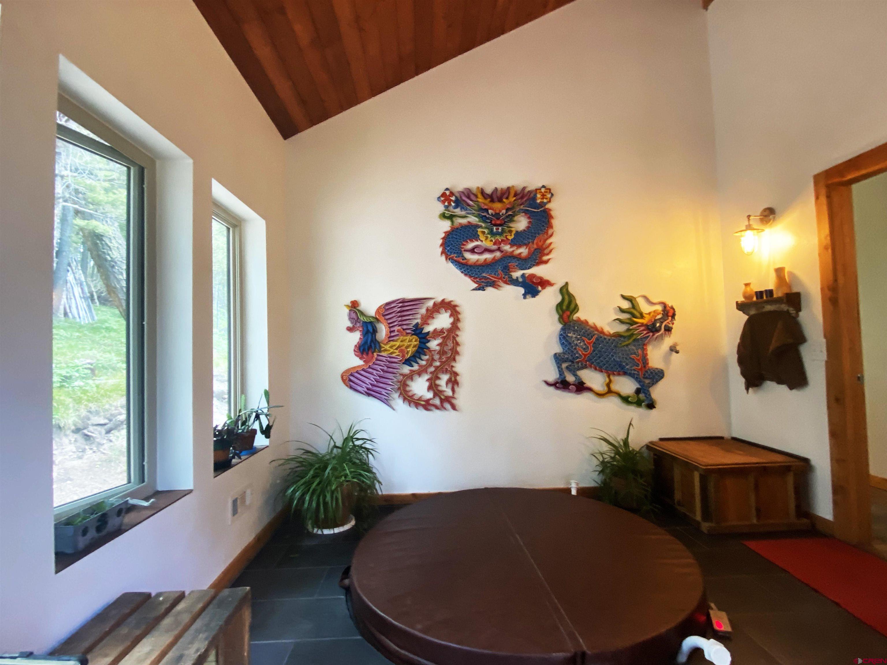 593 Crest Drive Cimarron, CO 81220 - Photo 2 of 30 a view of a workspace with furniture and a potted plant