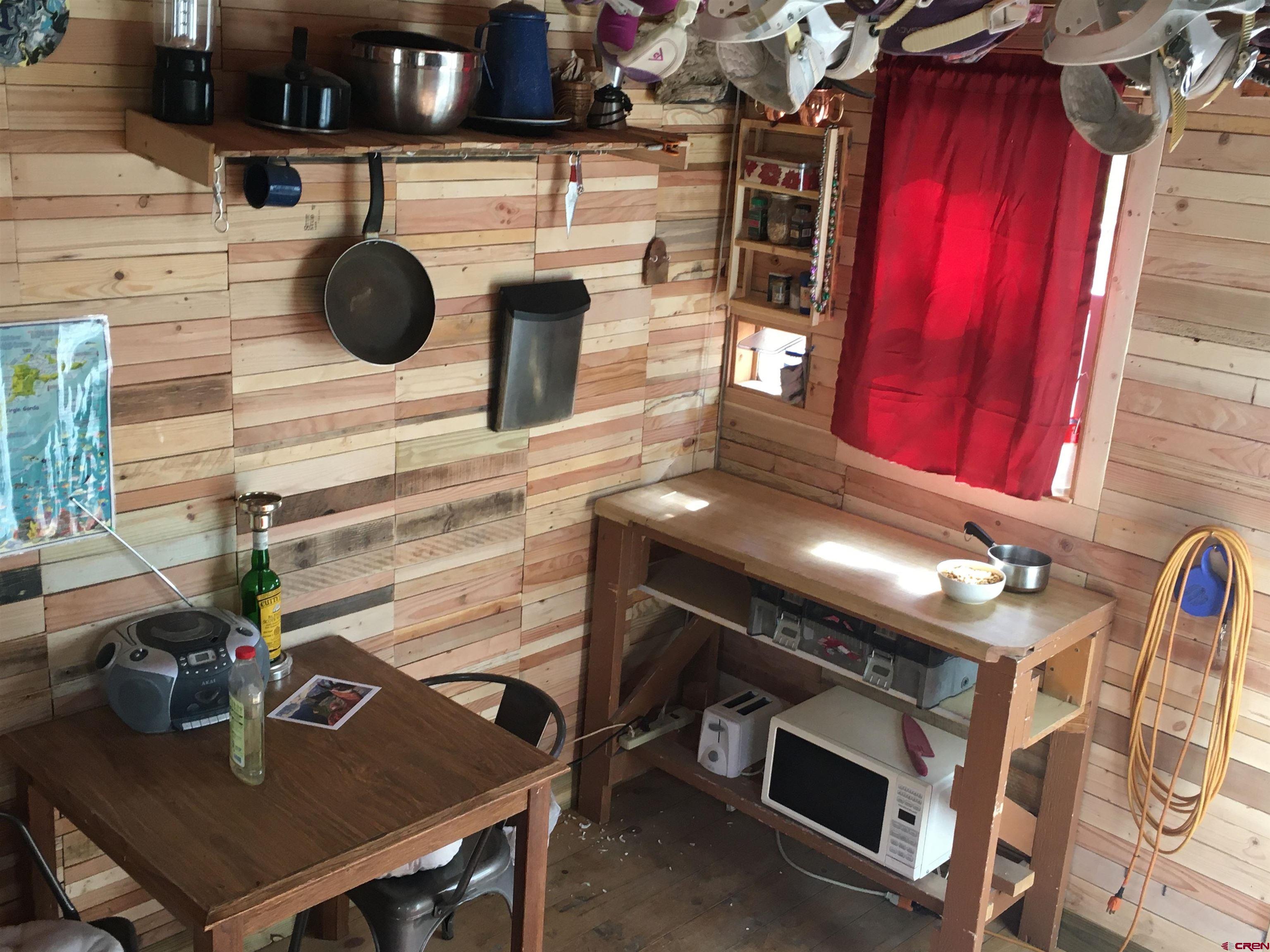 593 Crest Drive Cimarron, CO 81220 - Photo 27 of 30 a stove top oven sitting inside of a kitchen