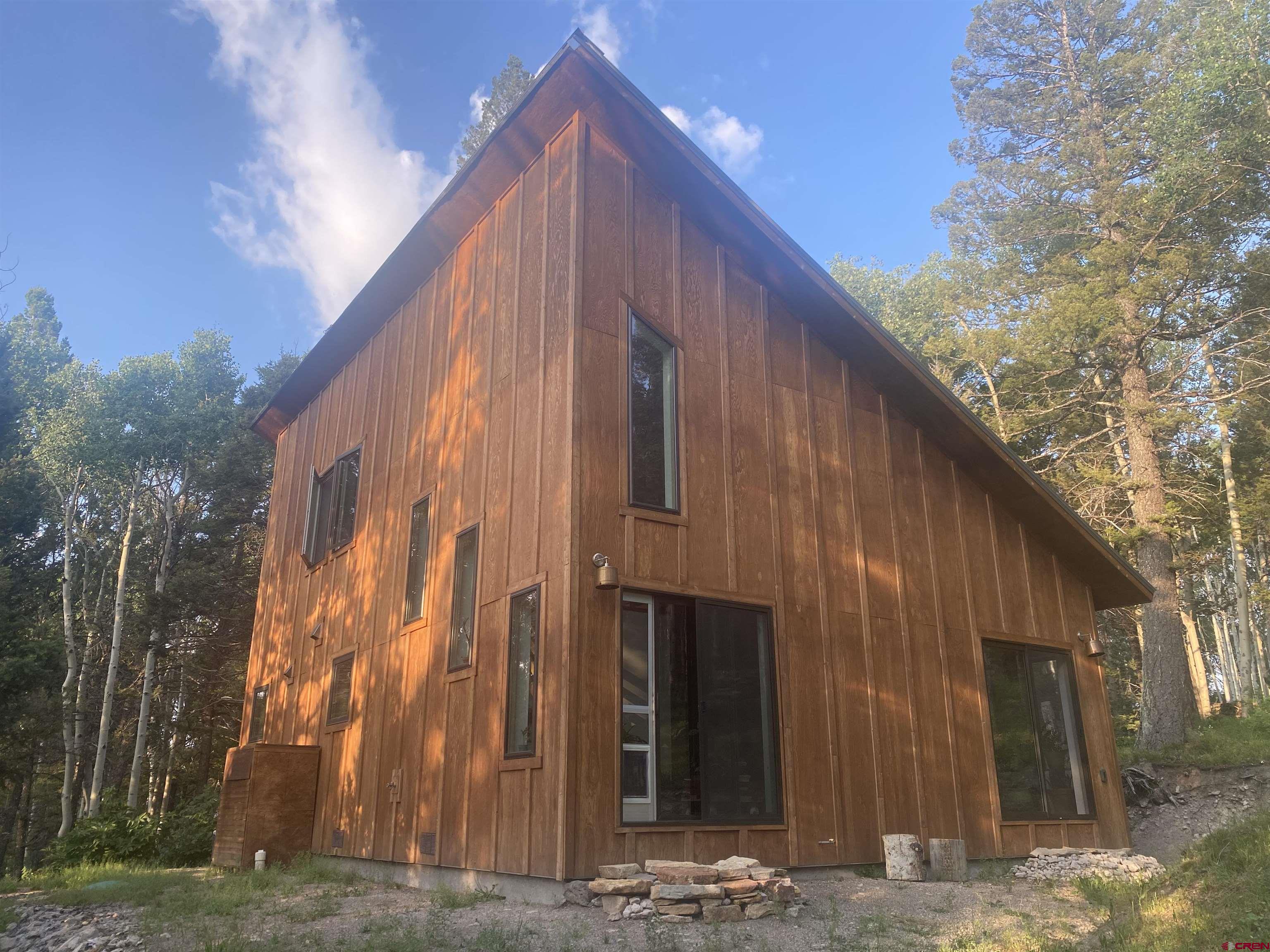 593 Crest Drive Cimarron, CO 81220 - Photo 28 of 30 a view of a house with a large windows