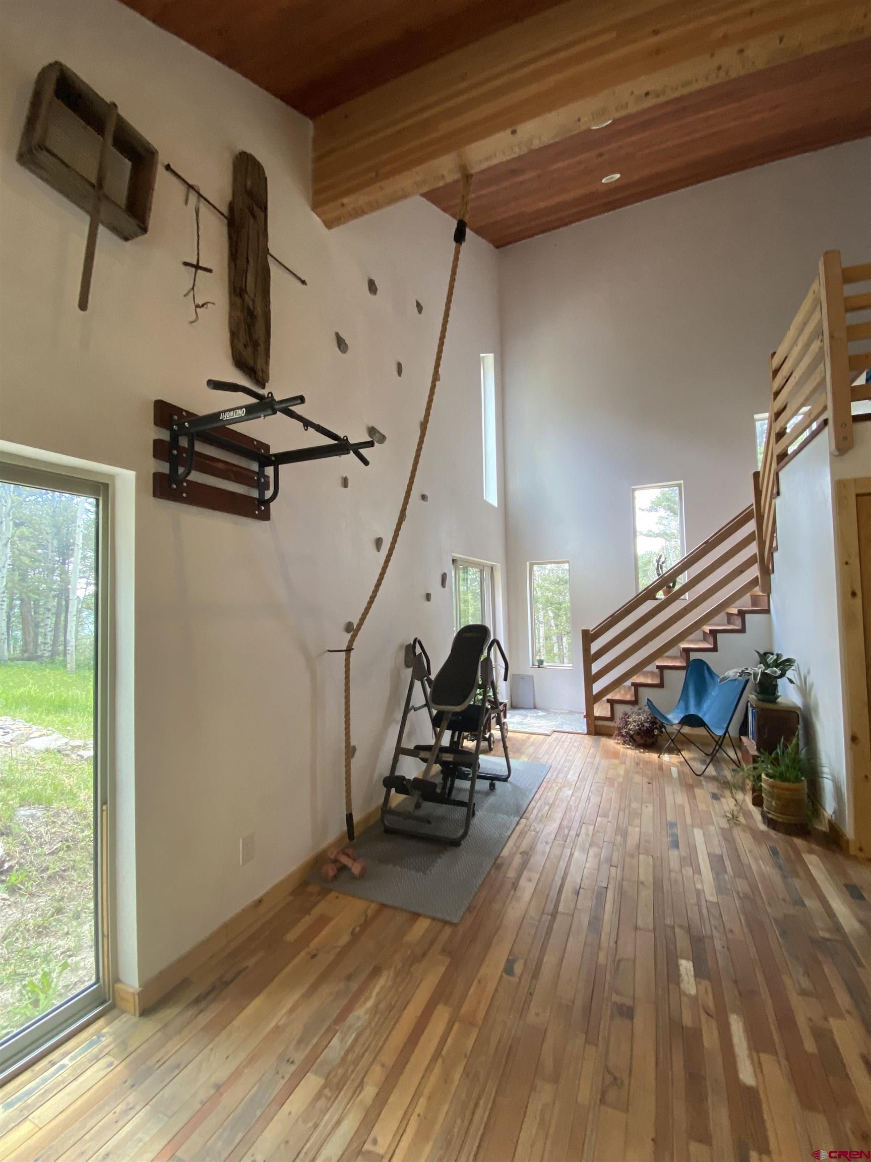 593 Crest Drive Cimarron, CO 81220 - Photo 8 of 30 a view of a room with wooden floor and windows