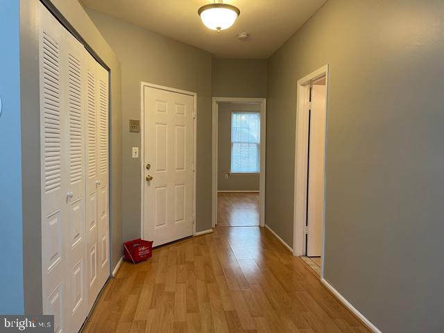 a view of a room with wooden floor and closet