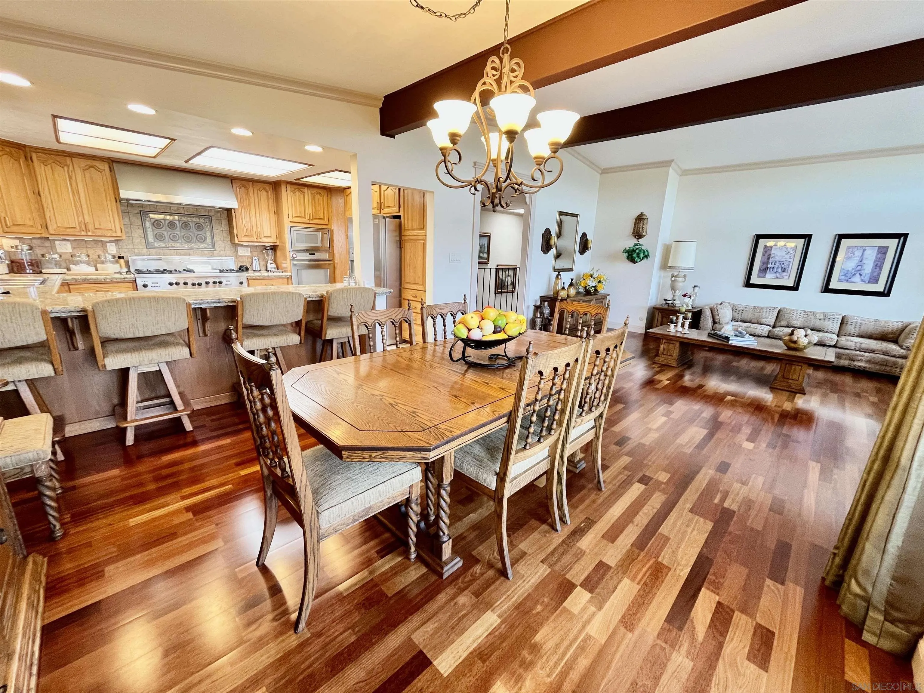 8844 Golf Drive Spring Valley, CA 91977 - Photo 14 of 56 a view of a dining room with furniture and a chandelier
