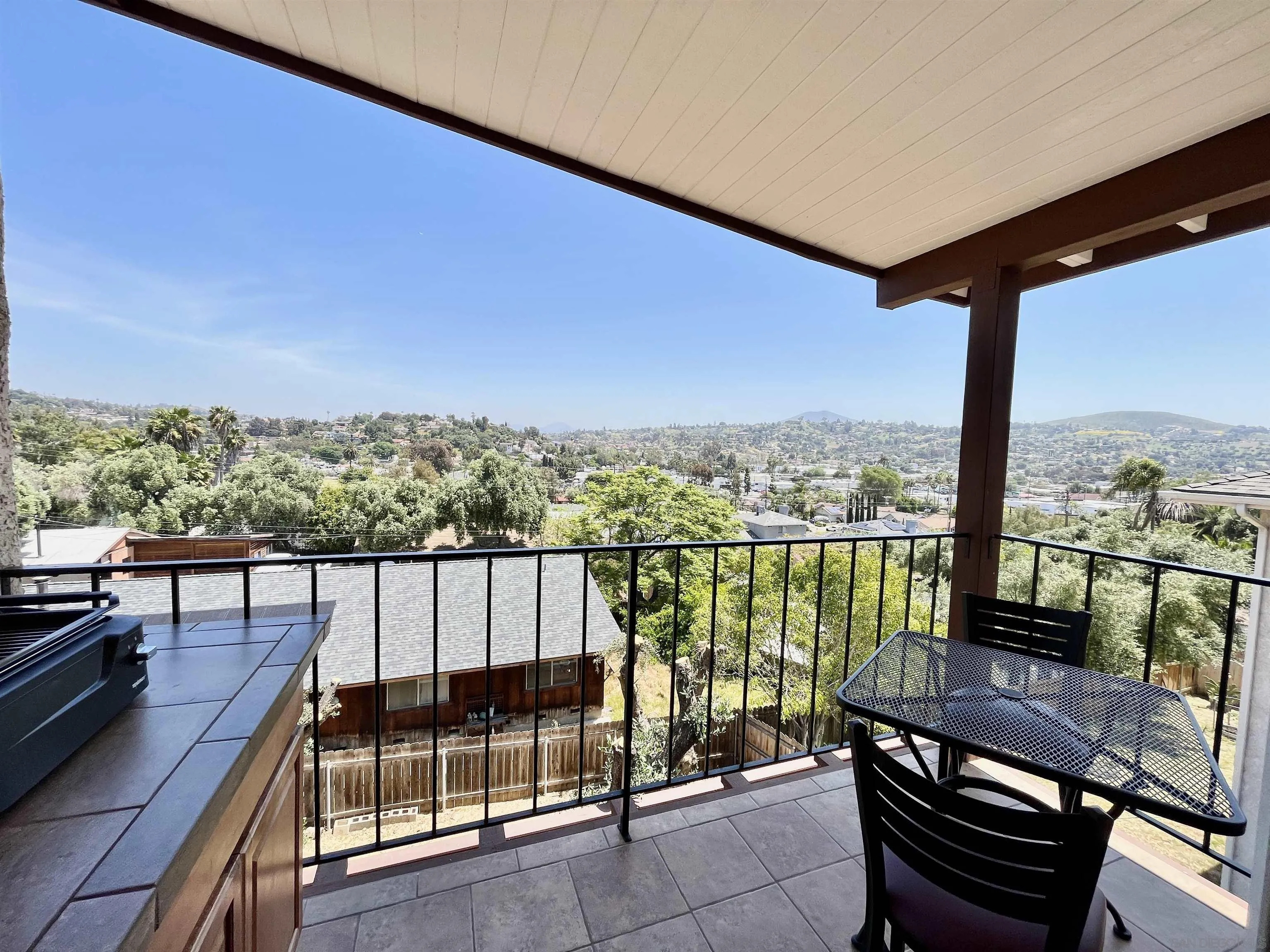8844 Golf Drive Spring Valley, CA 91977 - Photo 16 of 56 a view of a balcony with wooden floor and outdoor seating