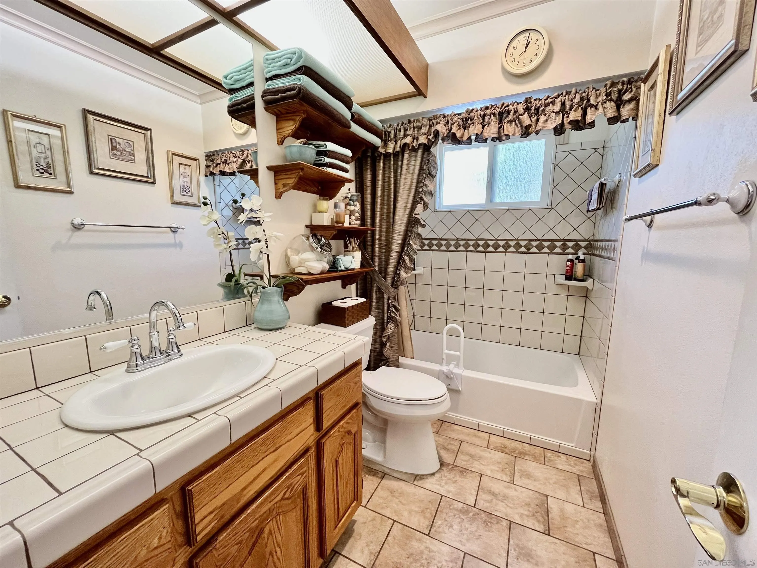 8844 Golf Drive Spring Valley, CA 91977 - Photo 17 of 56 a bathroom with a sink toilet and shower