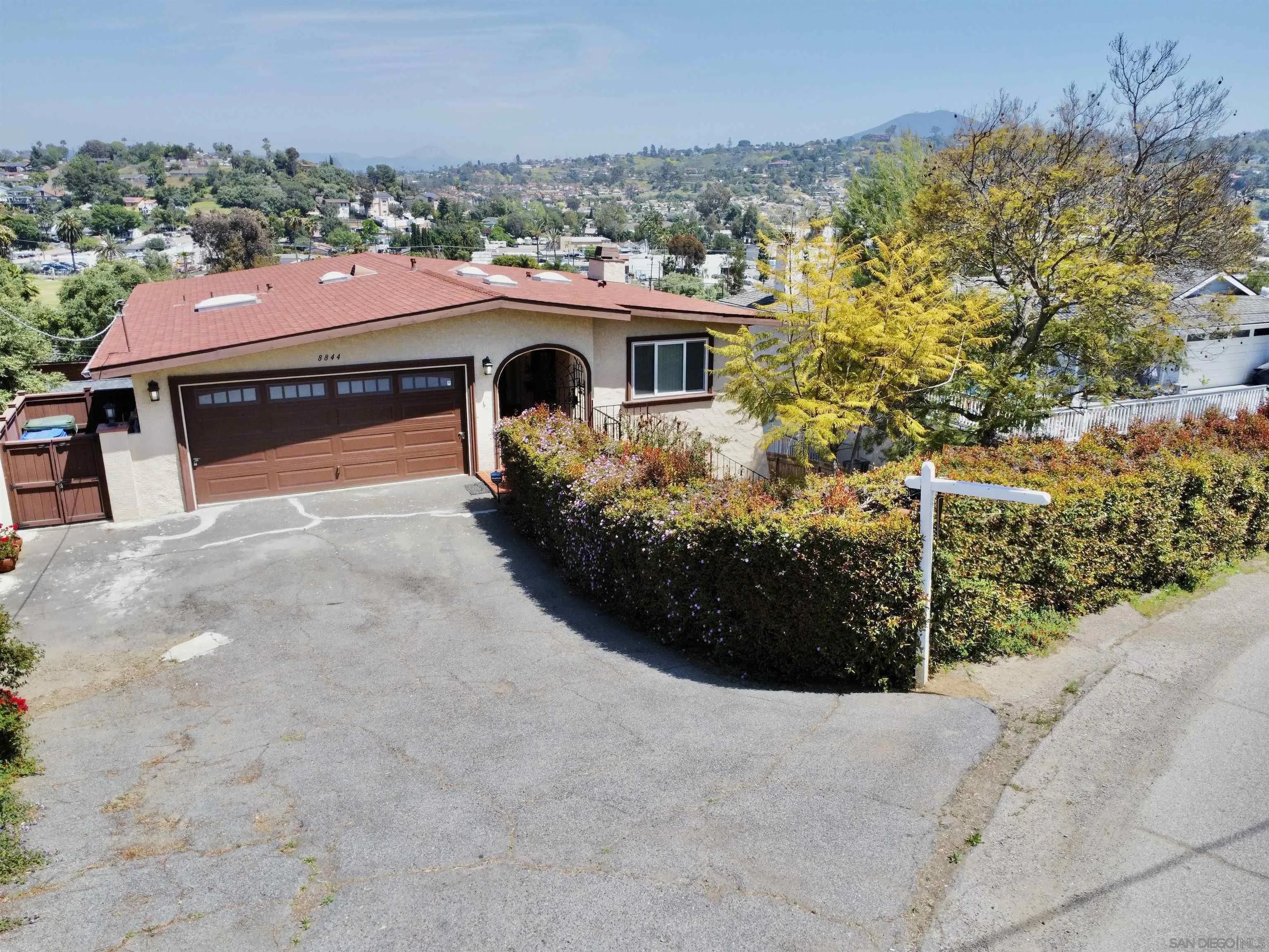 8844 Golf Drive Spring Valley, CA 91977 - Photo 2 of 56 a front view of a house with a yard