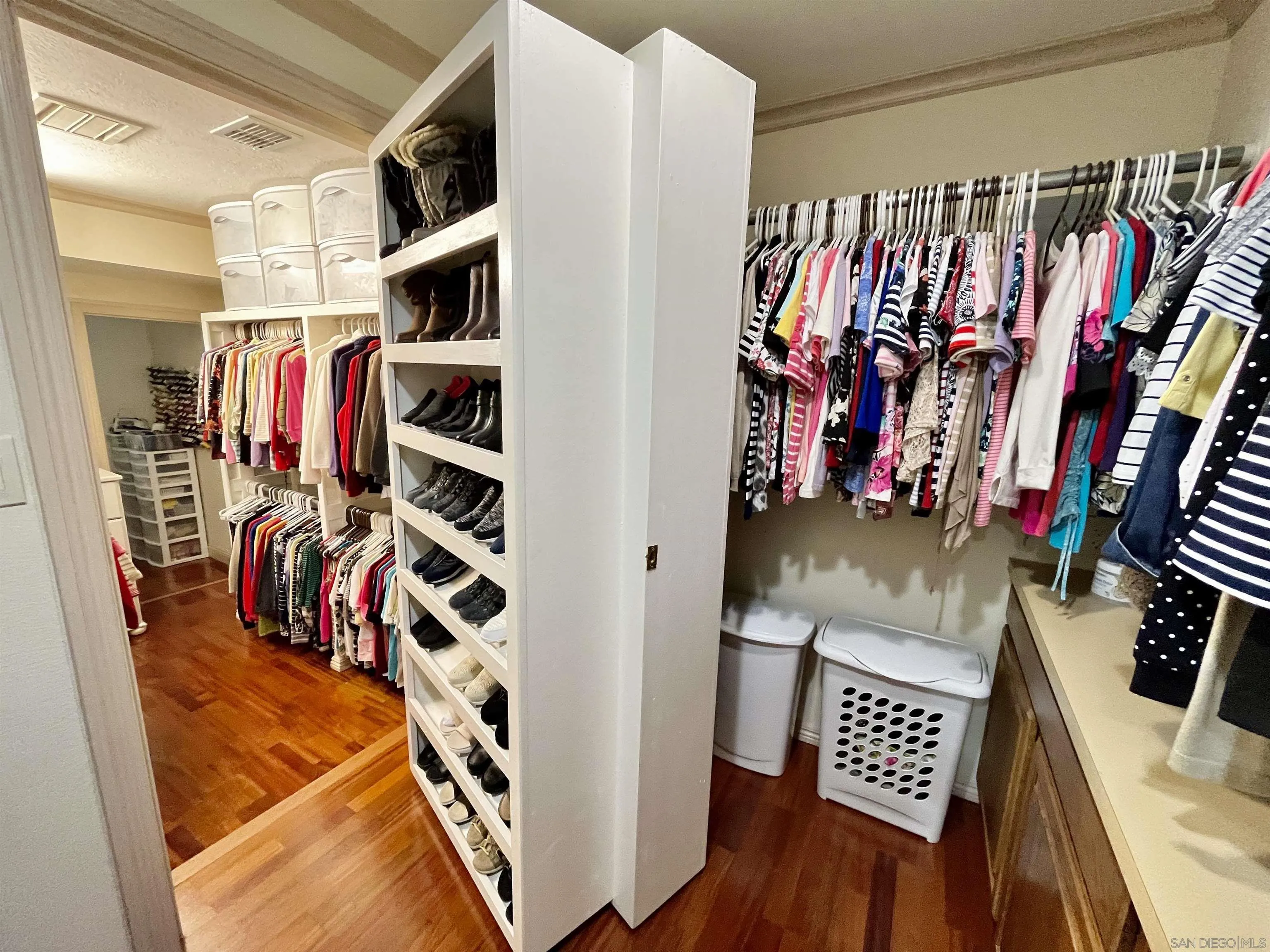 8844 Golf Drive Spring Valley, CA 91977 - Photo 24 of 56 a view of walk in closet with clothes and shoes