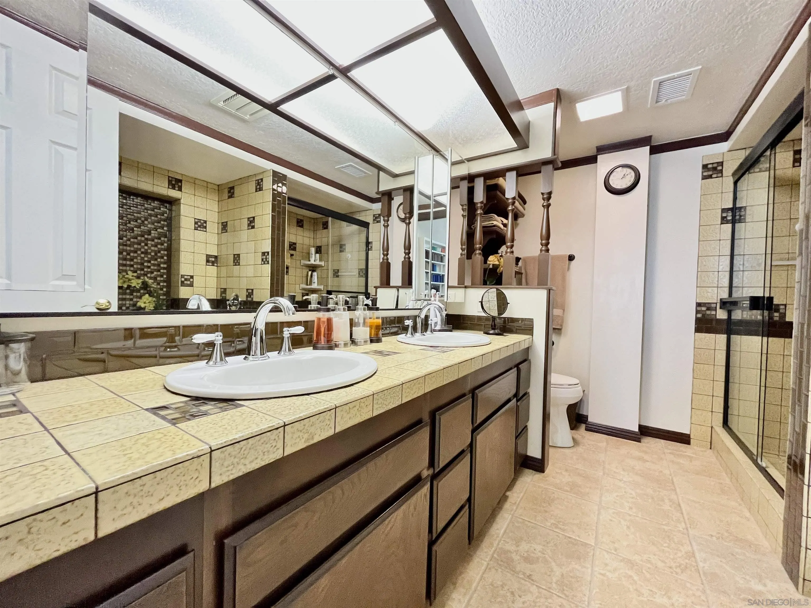 8844 Golf Drive Spring Valley, CA 91977 - Photo 27 of 56 a bathroom with sink and mirror