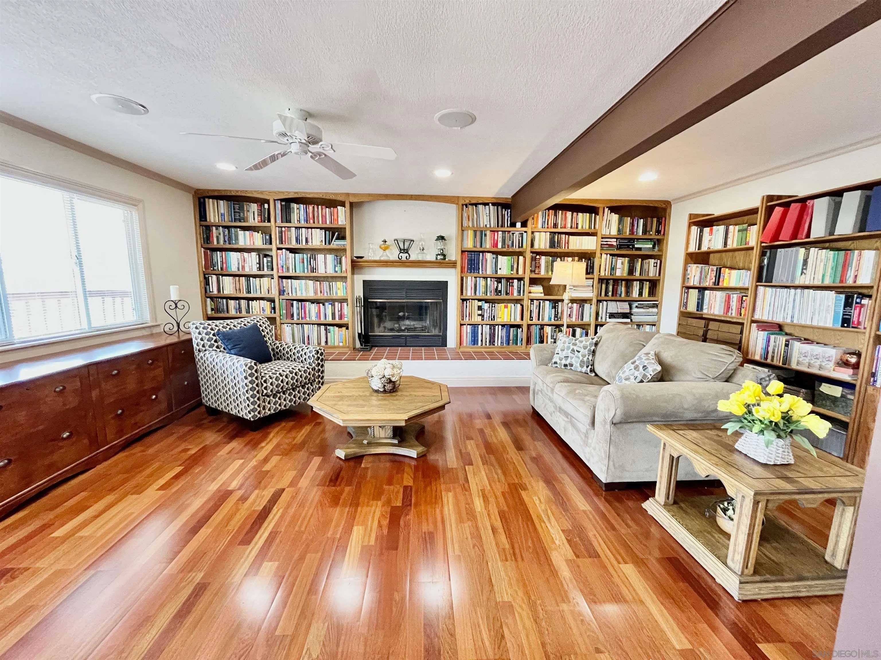 8844 Golf Drive Spring Valley, CA 91977 - Photo 31 of 56 a living room with furniture fireplace and wooden floor