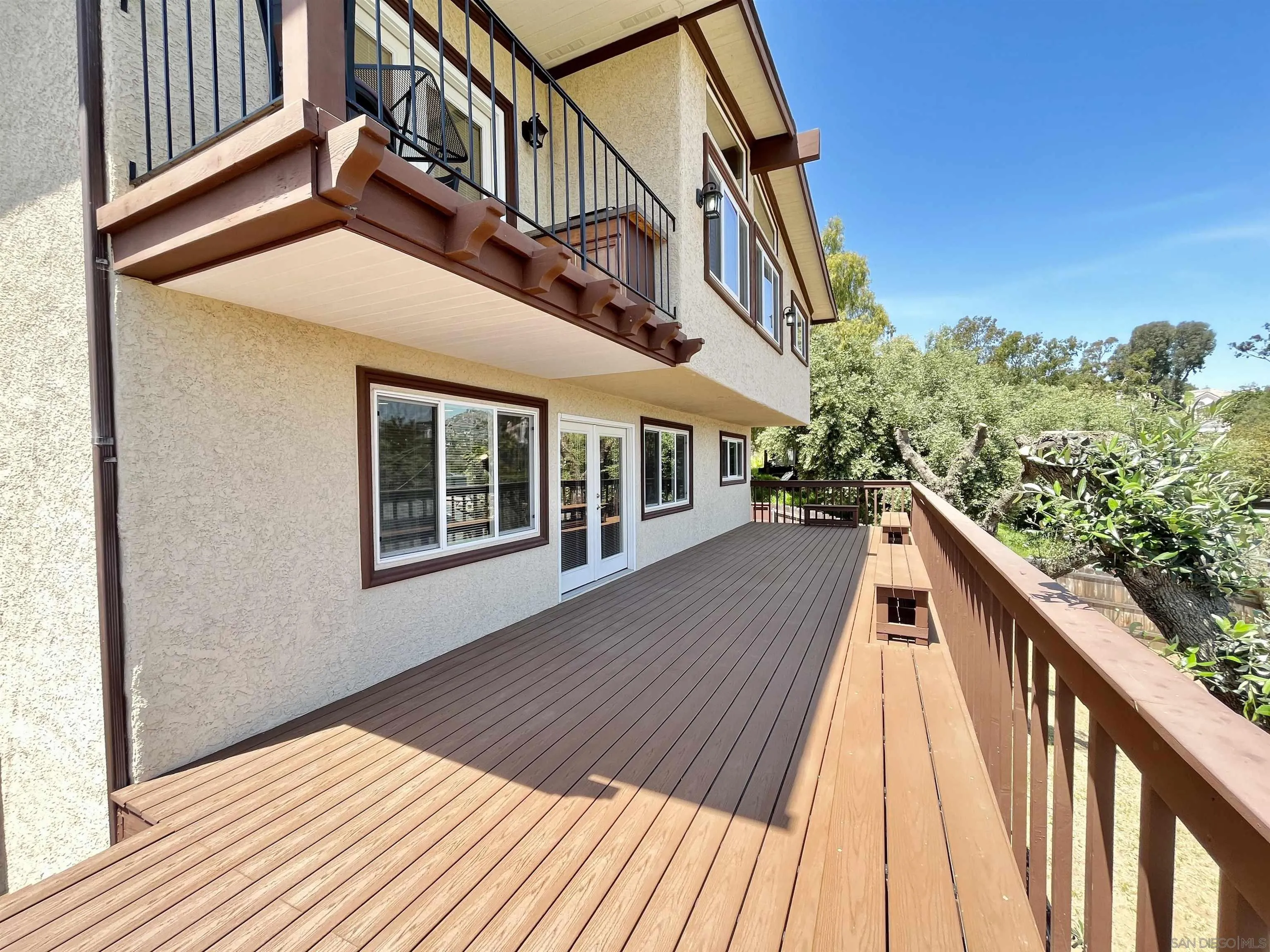 8844 Golf Drive Spring Valley, CA 91977 - Photo 41 of 56 a balcony view with wooden floor and fence