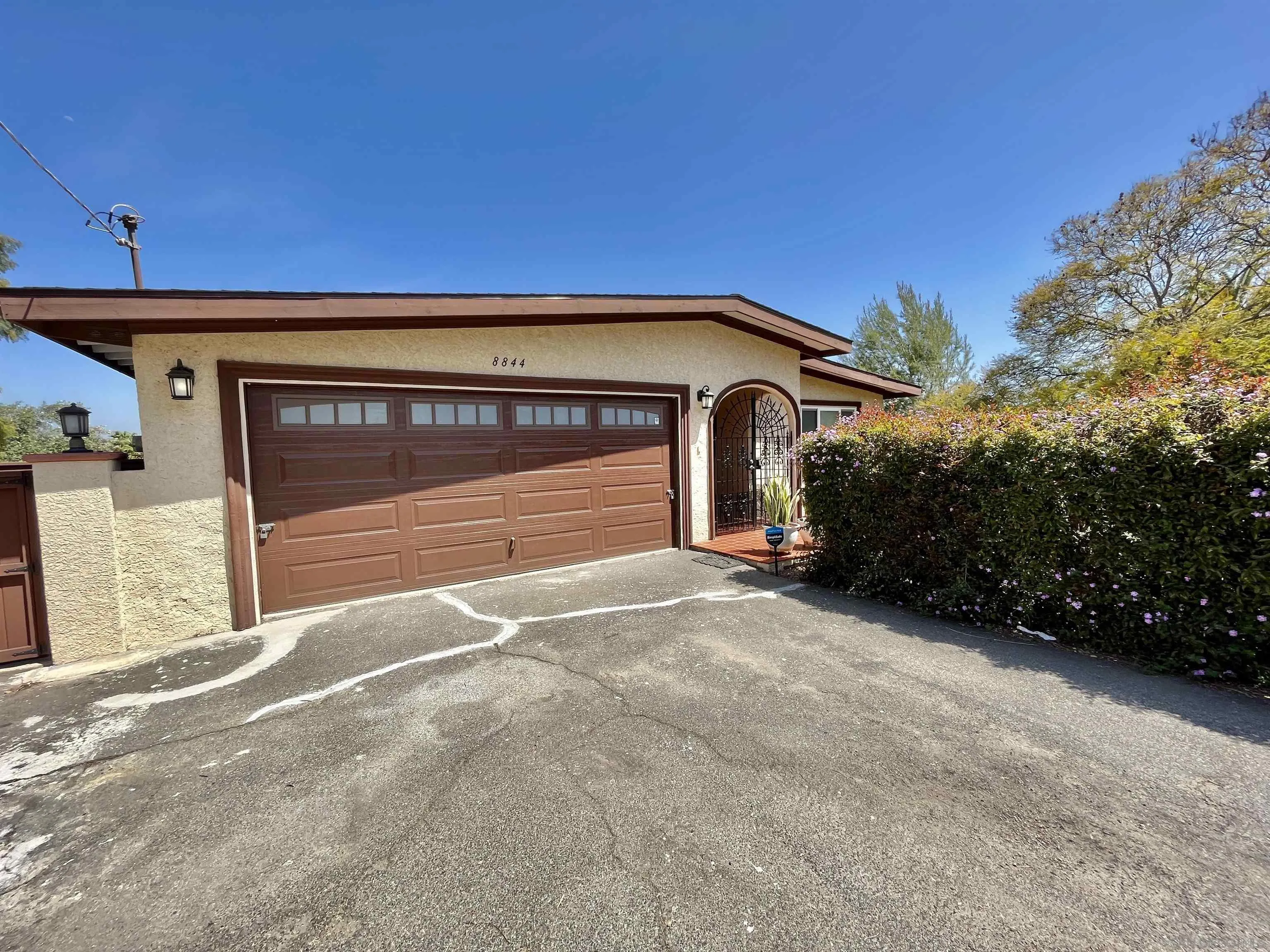 8844 Golf Drive Spring Valley, CA 91977 - Photo 52 of 56 a front view of a house with a garage