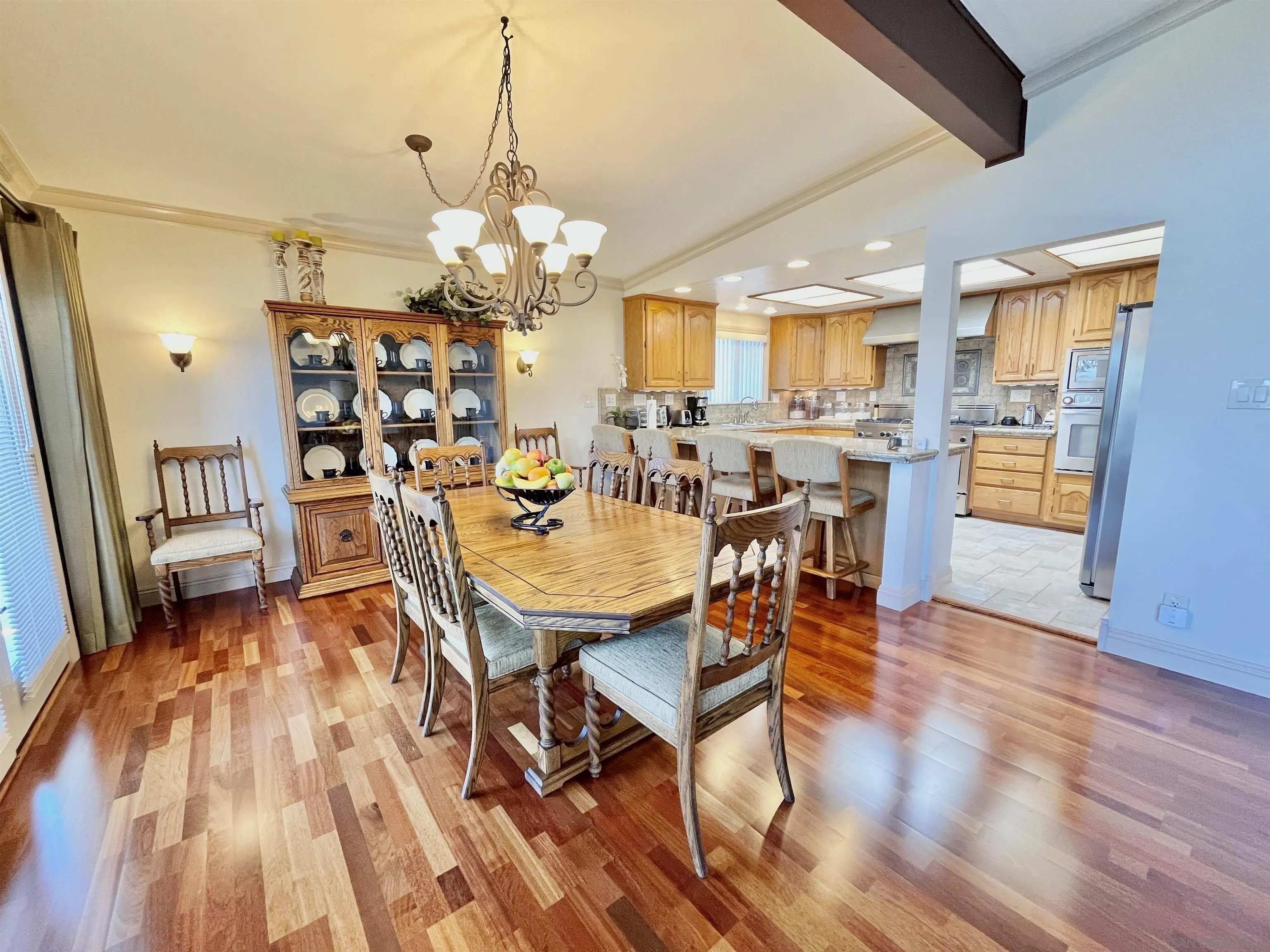 8844 Golf Drive Spring Valley, CA 91977 - Photo 9 of 56 a view of a dining room with furniture and wooden floor