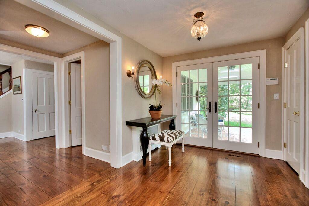 45 Ridge Acres Road Darien, CT 06820 - Photo 2 of 25 a view of a room with wooden floor staircase and windows