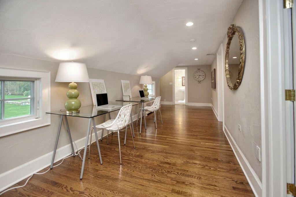 45 Ridge Acres Road Darien, CT 06820 - Photo 19 of 25 a view of a dining room with furniture and wooden floor