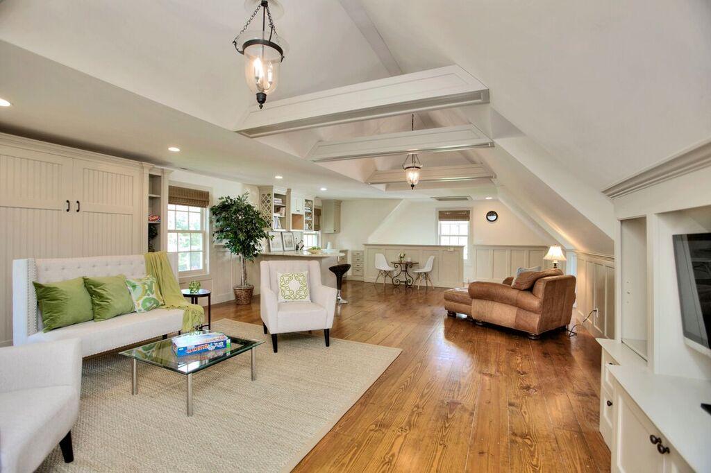 45 Ridge Acres Road Darien, CT 06820 - Photo 22 of 25 a living room with furniture and wooden floor
