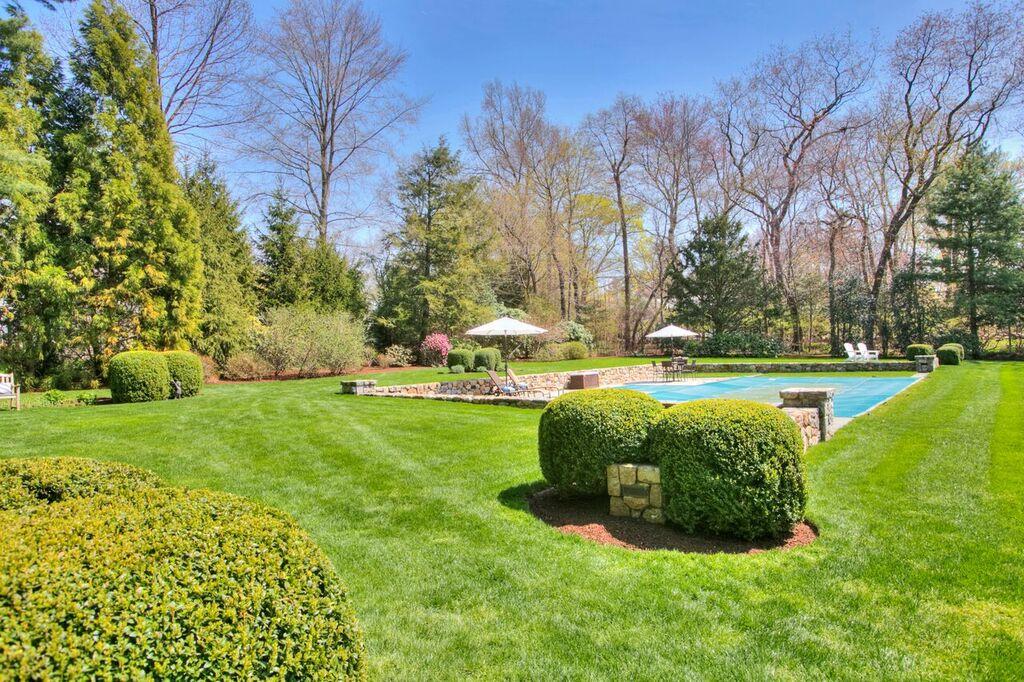 45 Ridge Acres Road Darien, CT 06820 - Photo 24 of 25 a view of a garden with large trees