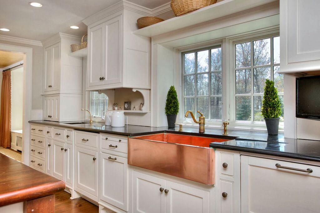45 Ridge Acres Road Darien, CT 06820 - Photo 8 of 25 a kitchen with granite countertop a sink a stove and cabinets