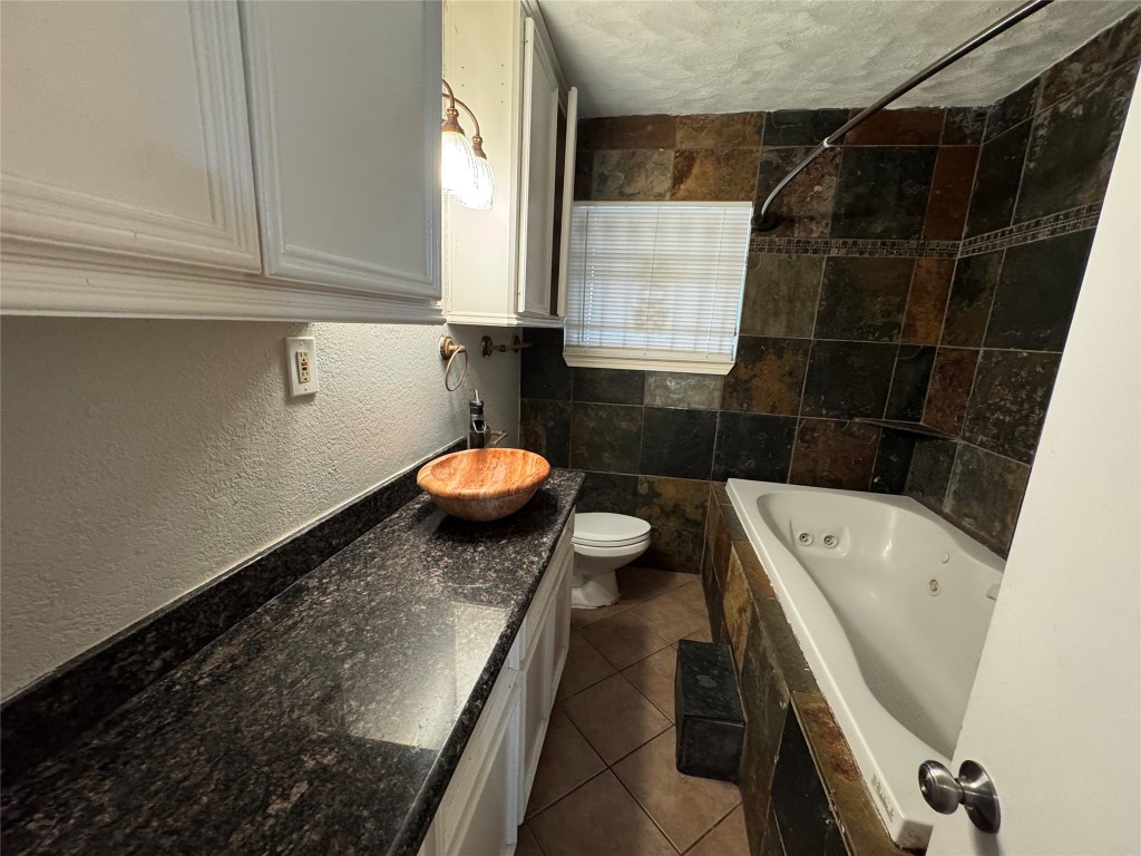 3007 Trenton Road Houston, TX 77093 - Photo 7 of 12 a bathroom with a sink and a bathtub