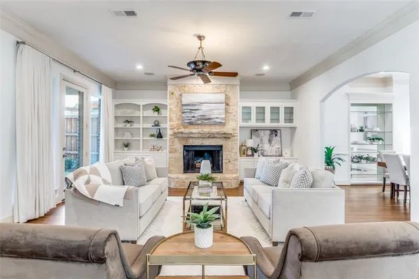 a living room with furniture and a fireplace