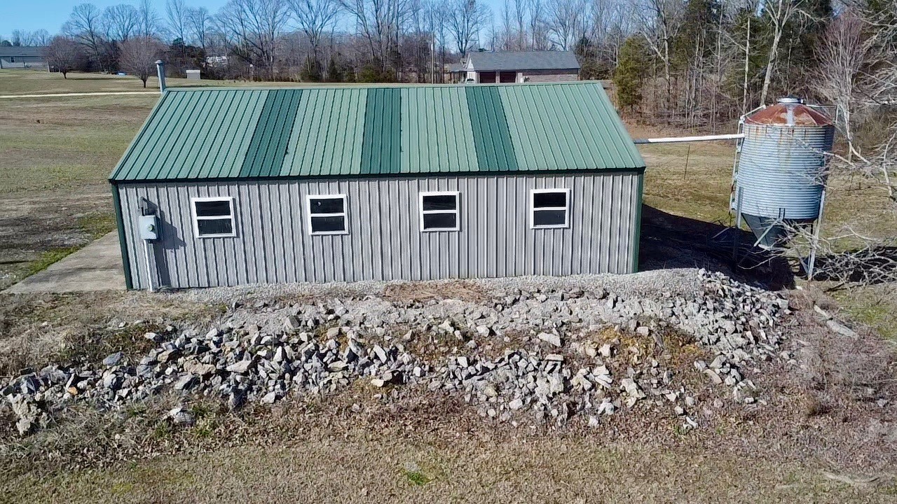 320 South Point Drive Camden, TN 38320 - Photo 6 of 62 a view of a small house in the back yard