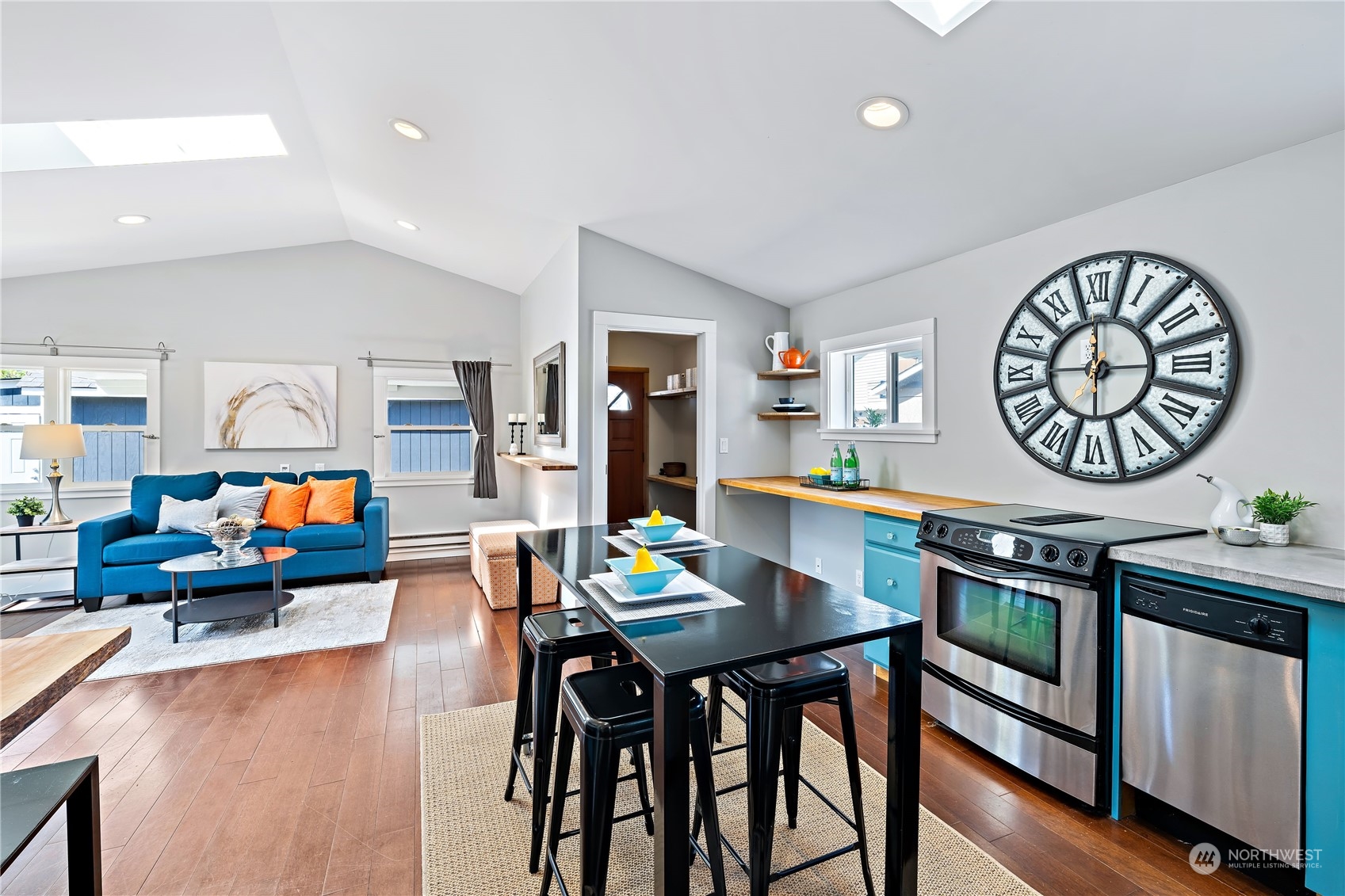 9012 7th Avenue Northwest Seattle, WA 98117 - Photo 13 of 36 a living room with furniture and a flat screen tv