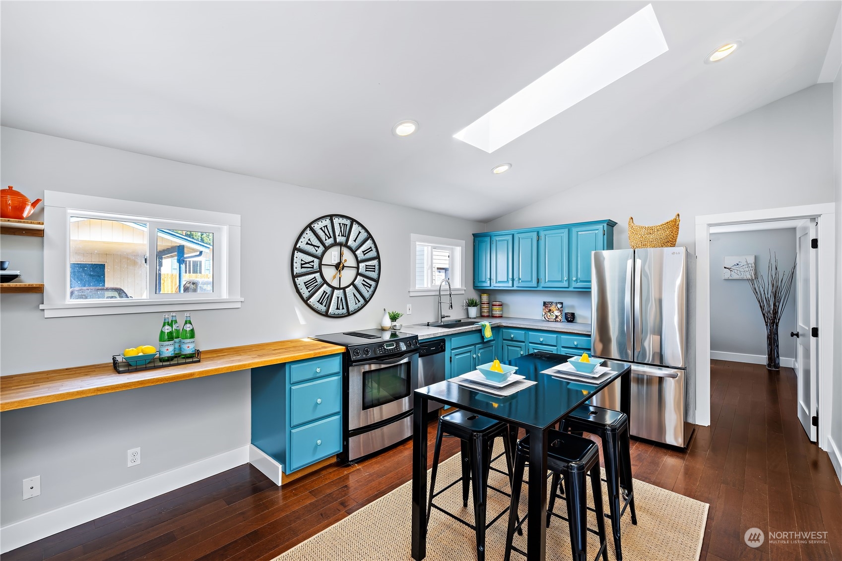 9012 7th Avenue Northwest Seattle, WA 98117 - Photo 14 of 36 a kitchen with a table and chairs in it