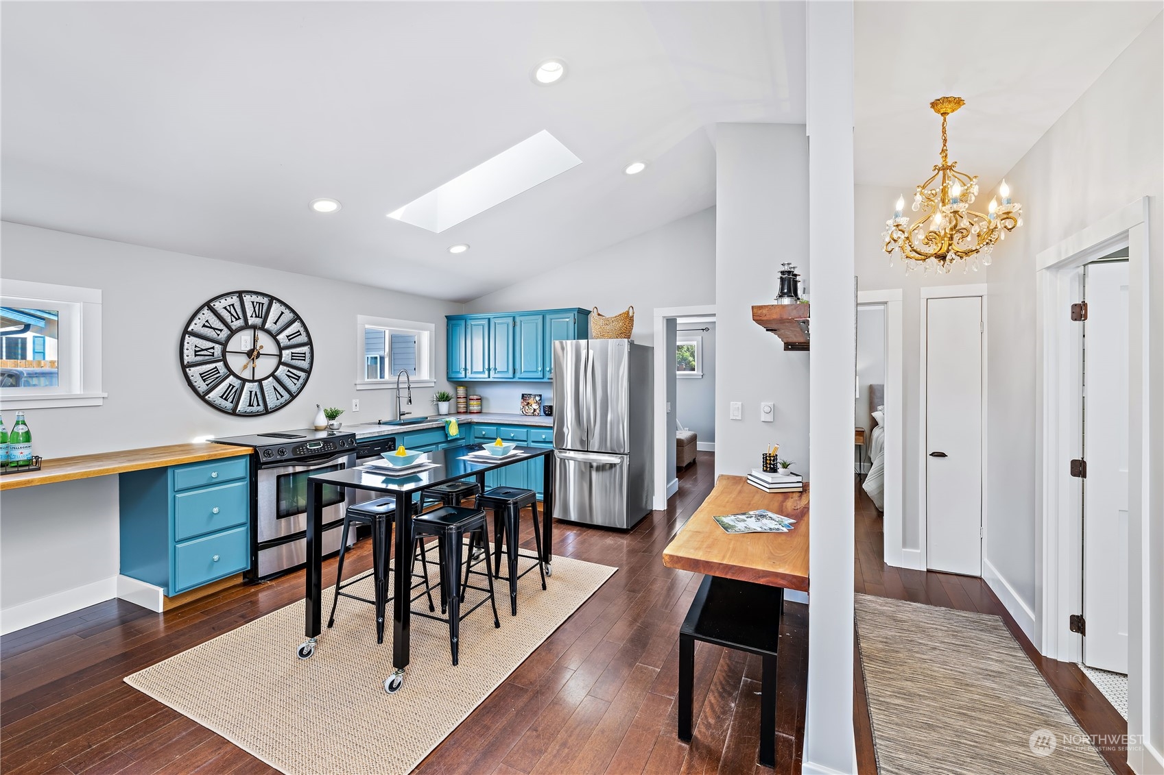 9012 7th Avenue Northwest Seattle, WA 98117 - Photo 19 of 36 a view of a dining room with furniture and wooden floor