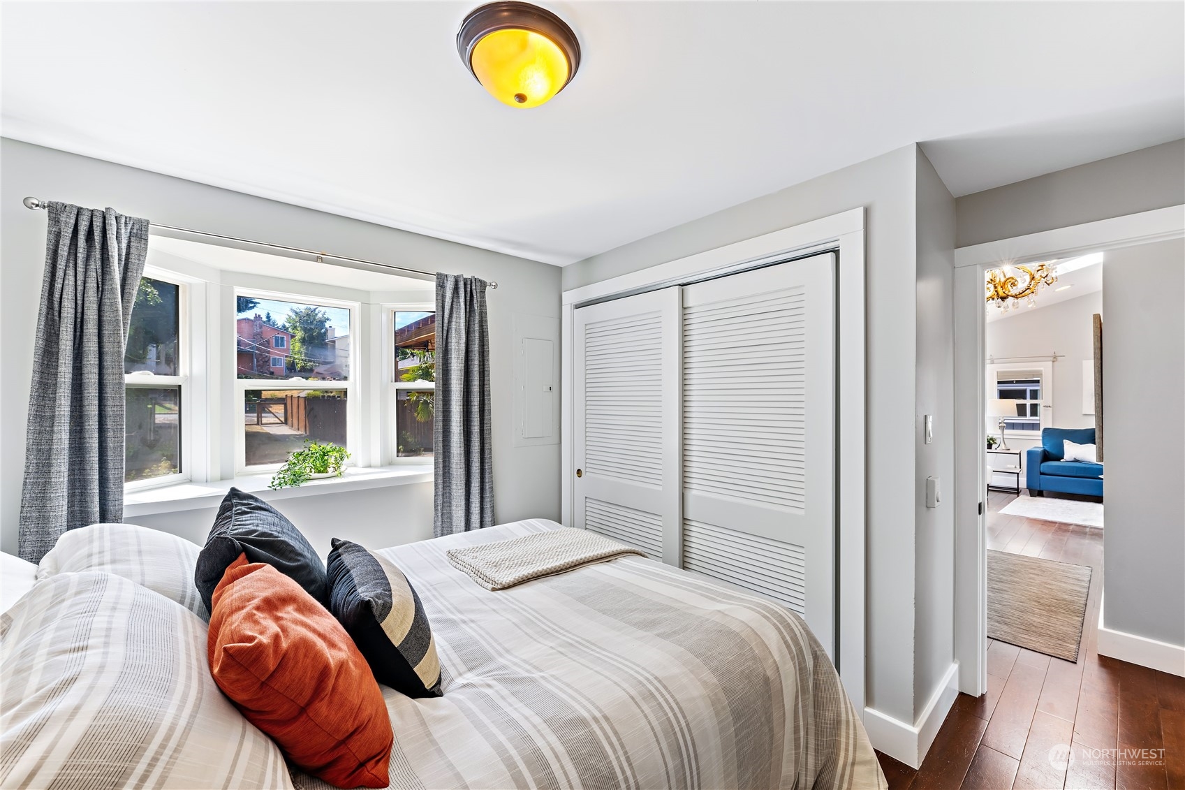 9012 7th Avenue Northwest Seattle, WA 98117 - Photo 22 of 36 a bedroom with a bed and a window