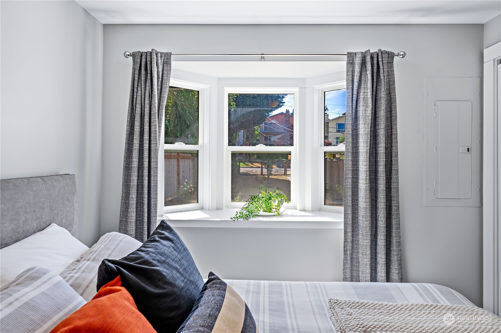 9012 7th Avenue Northwest Seattle, WA 98117 - Photo 23 of 36 a bedroom with a bed and a window
