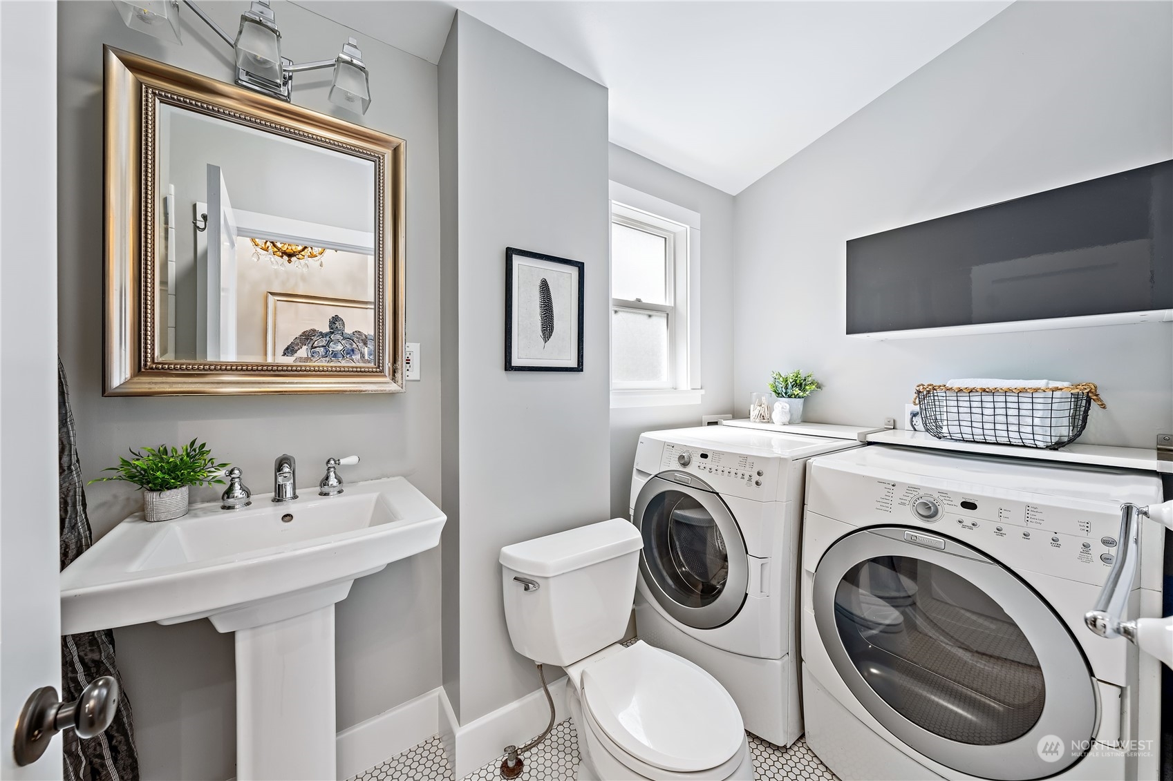 9012 7th Avenue Northwest Seattle, WA 98117 - Photo 24 of 36 a bathroom with a toilet a sink and a mirror