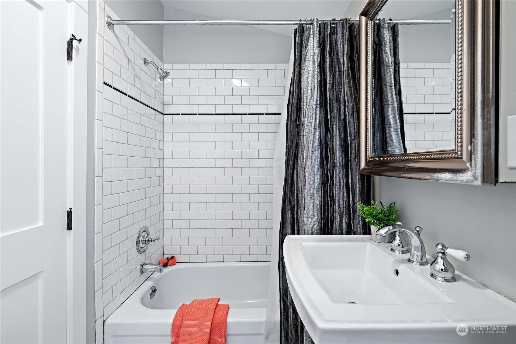 9012 7th Avenue Northwest Seattle, WA 98117 - Photo 25 of 36 a bathroom with a sink and a bathtub