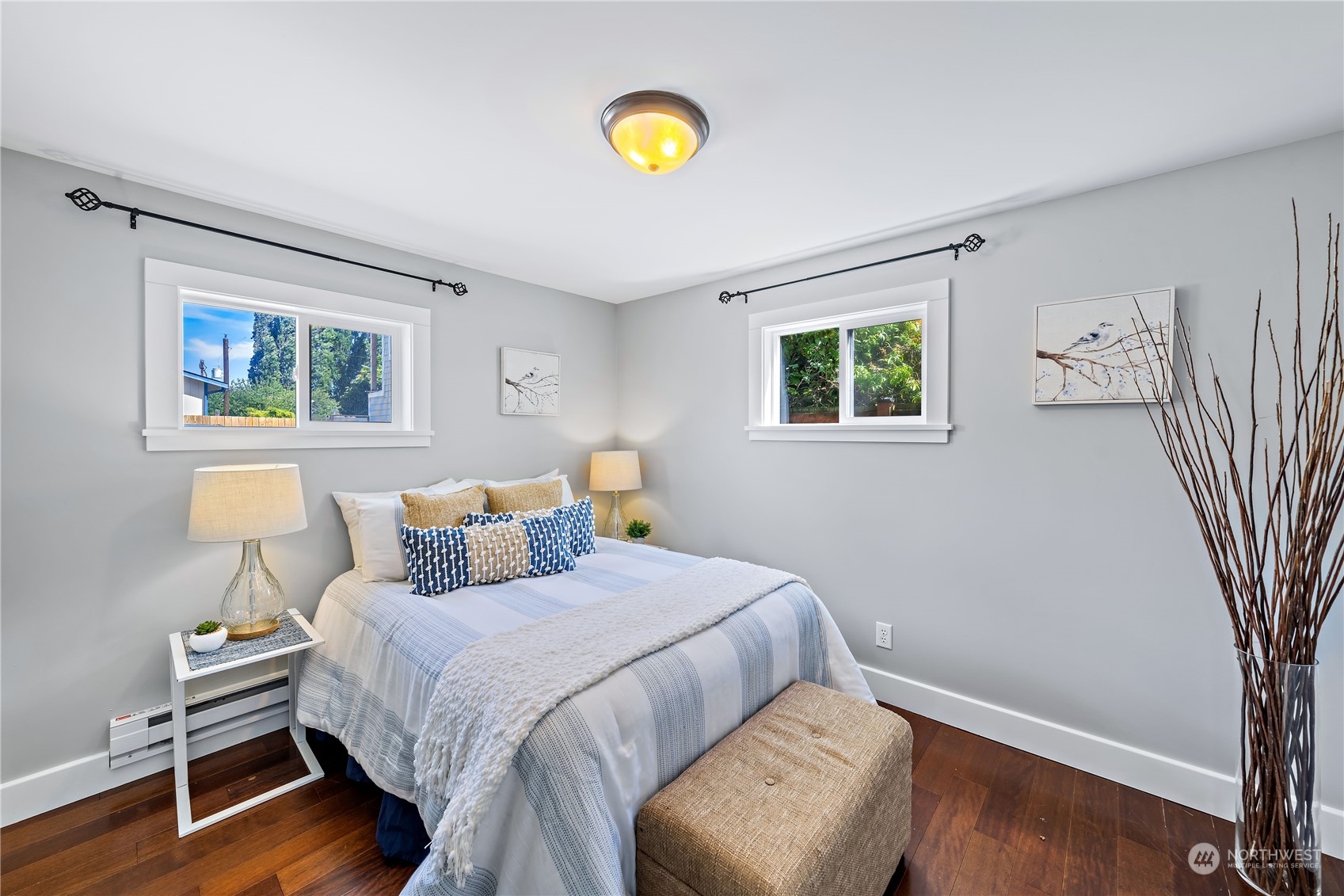 9012 7th Avenue Northwest Seattle, WA 98117 - Photo 26 of 36 a bedroom with a bed and a lamp on dresser